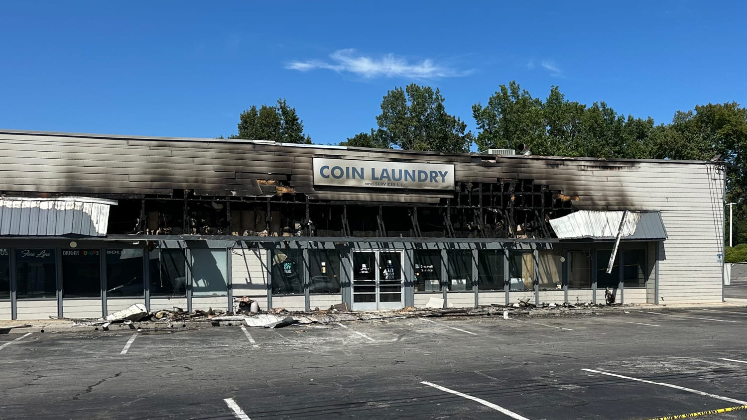 Exterior of a burned down commercial coin laundromat after a fire