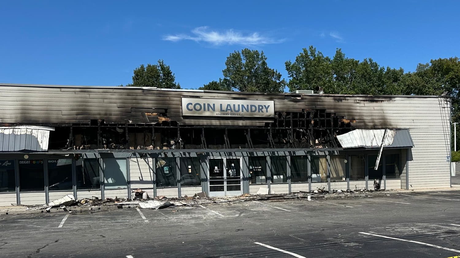 Exterior of a burned down commercial coin laundromat after a fire