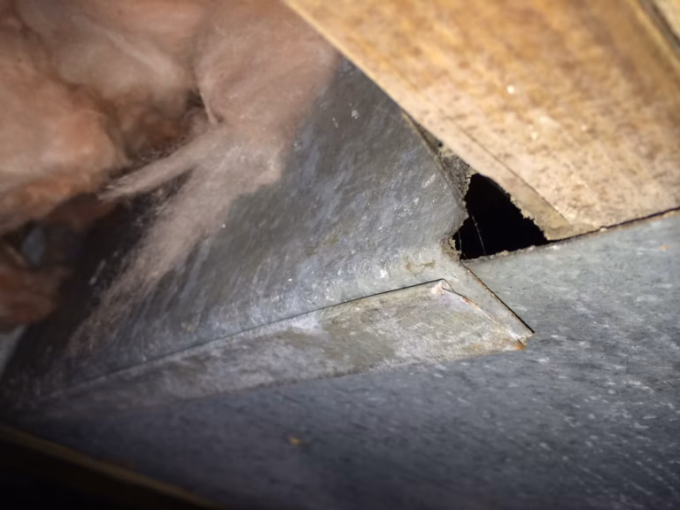 Photo from the crawl space of a Sevierville, TN home shows a gap in the panning of the HVAC return in this home.